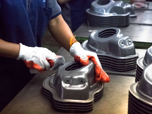 Close-up of an engineer’s hand working on electronic components of a car 